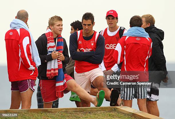 Swans players stretch during a Sydney Swans AFL recovery session at Coogee Beach on April 25, 2010 in Sydney, Australia.