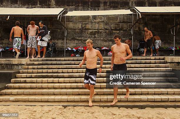 Ryan O'Keefe and Mike Pyke of the Swans walk down to the water during a Sydney Swans AFL recovery session at Coogee Beach on April 25, 2010 in...