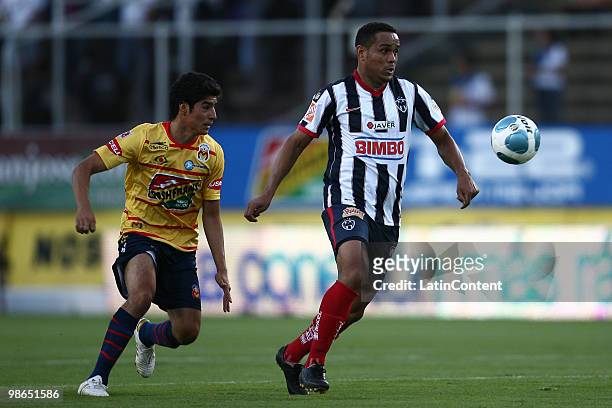 Morelia's Enrique Perez vies for the ball with William Paredes of Monterrey during a 2010 Bicentenary Mexican championship soccer match between...