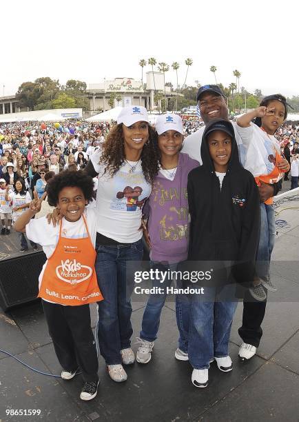 In this handout photo provided by Autism Speaks, Former NFL Player Rodney Peete with wife Actress Holly Robinson Peete and family pose for a photo at...