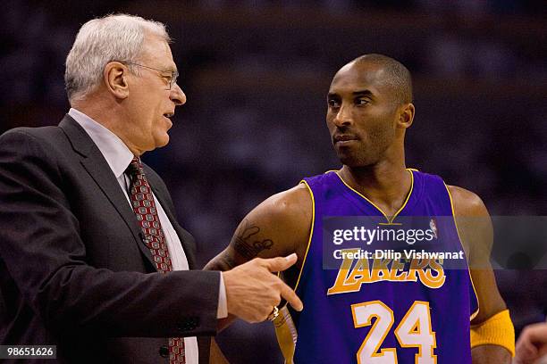 Head coach Phil Jackson and Kobe Bryant of the Los Angeles Lakers talk prior to playing against the Oklahoma City Thunder during Game Four of the...