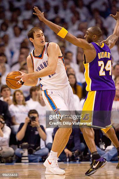 Nenad Krstic of the Oklahoma City Thunder looks to pass the ball against Kobe Bryant of the Los Angeles Lakers during Game Four of the Western...