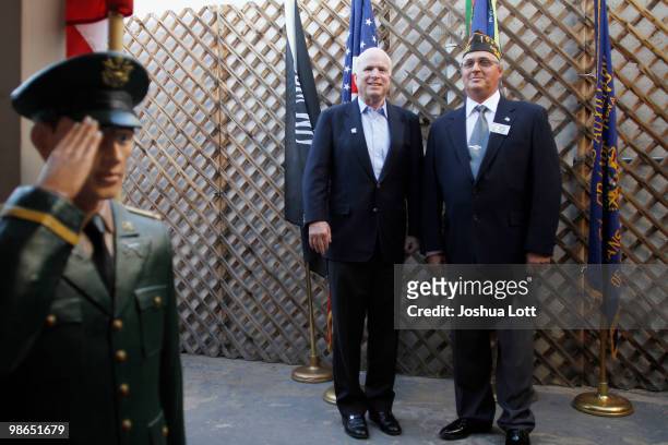 Sen. John McCain poses for a picture with veteran Richard Philippi at VFW Post during a campaign stop on April 24, 2010 in Casa Grande, Arizona....