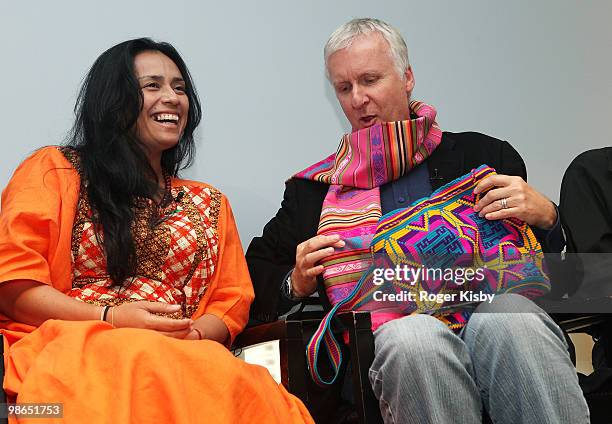 Leader of the Wayuu indigenous people of La Guajira, Colombia, Karmen Ramirez Boscan gives director James Cameron a gift at the Real Life Pandoras On...
