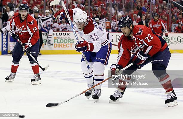 Mike Knuble of the Washington Capitals skates against Mike Cammalleri of the Montreal Canadiens in Game Five of the Eastern Conference Quarterfinals...