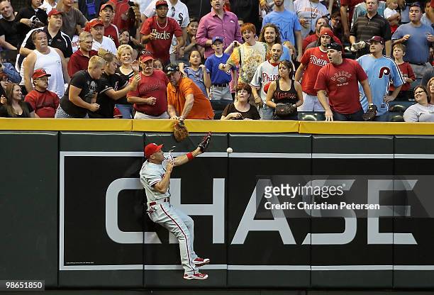 Outfielder Raul Ibanez of the Philadelphia Phillies is unable to catch a fly ball double hit by Chris Young of the Arizona Diamondbacks during the...