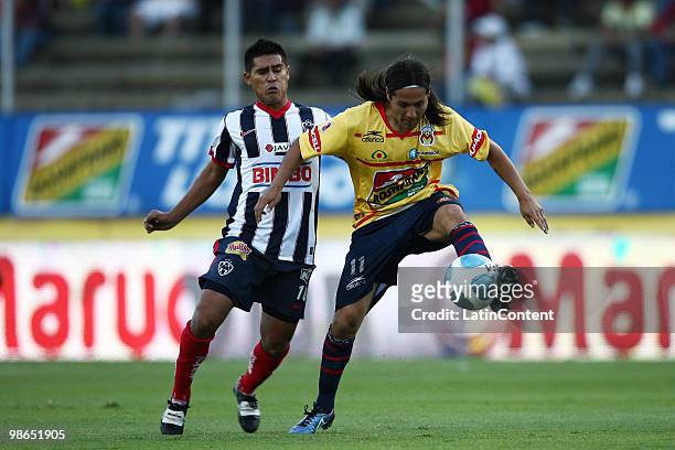Morelia's Hugo Droguett vies for the ball with Osvaldo Martinez of Monterrey during a 2010 Bicentenary Mexican championship soccer match between...