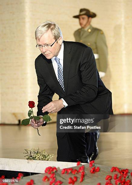 Prime Minister Kevin Rudd places a single rose at the foot of the Tomb of the Unknown Soldier during the ANZAC Day National Ceremony at the...