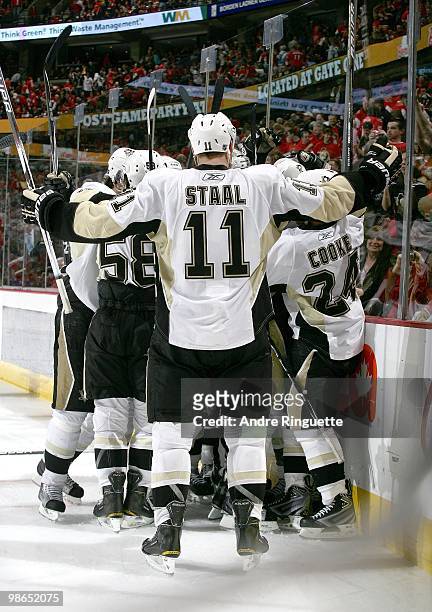 Jordan Staal the Pittsburgh Penguins celebrates the overtime, series clinching goal against the Ottawa Senators with teammates in Game Six of the...