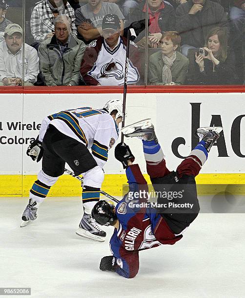 Galiardi of the Colorado Avalanche gets upended on an open ice check by Scott Nichol of the San Jose Sharks in the first period of Game Six of the...