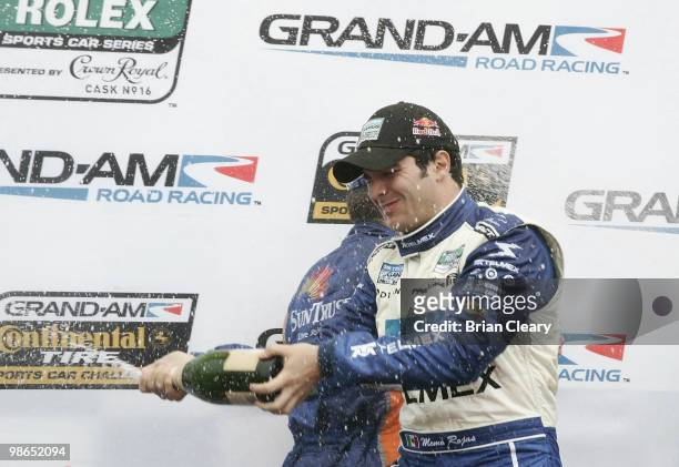 Memo Rojas sprays champagne in victory lane after the Bosch Engineering 250 at Virginia International Raceway on April 24, 2010 in Alton, Virginia.