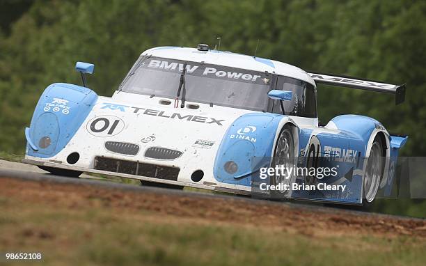 The BMW Riley of Scott Pruett and Memo Rojas crests a hill during the Bosch Engineering 250 at Virginia International Raceway on April 24, 2010 in...