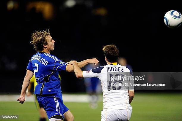 Michael Harrington of the Kansas City Wizards advances the ball as Mike Magee of the Los Angeles Galaxy defends on April 24, 2010 at Community...