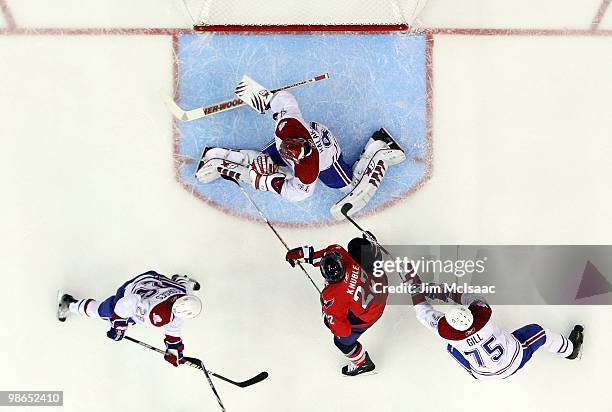 Mike Knuble of the Washington Capitals is stopped by Jaroslav Halak, Josh Gorges, and Hal Gill of the Montreal Canadiens in Game Five of the Eastern...