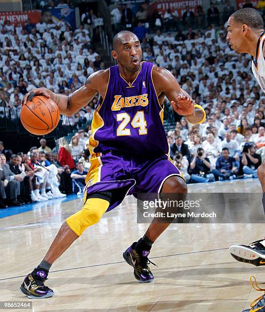 Kobe Bryant of the Los Angeles Lakers drives to the basket against Thabo Sefolosha of the Oklahoma City Thunder in Game Four of the Western...