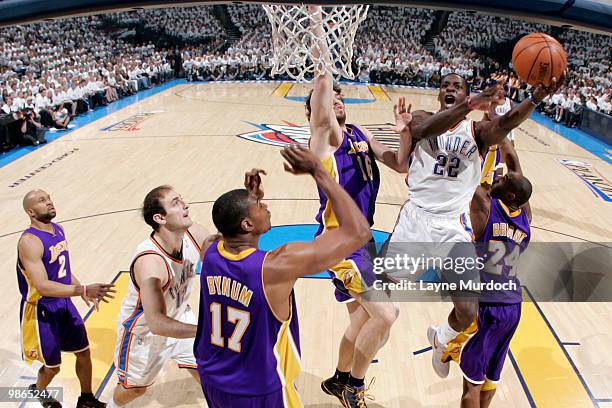 Jeff Green of the Oklahoma City Thunder goes to the basket against Pau Gasol and Kobe Bryant of the Los Angeles Lakers in Game Four of the Western...