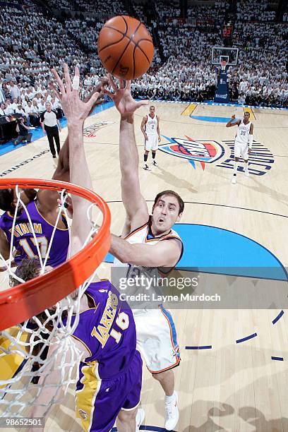 Nenad Krstic of the Oklahoma City Thunder shoots over Pau Gasol of the Los Angeles Lakers in Game Four of the Western Conference Quarterfinals during...