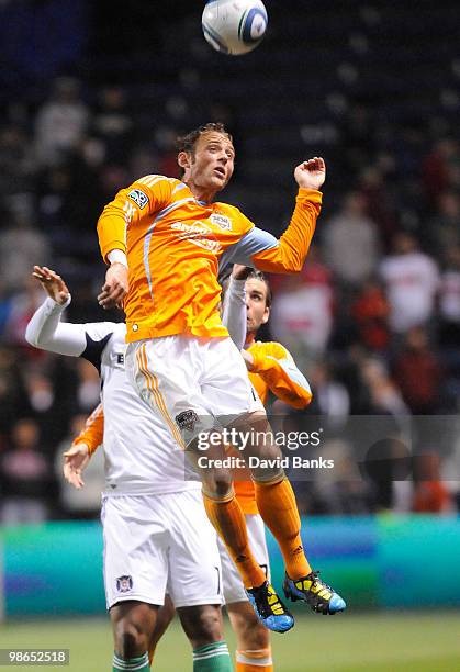 Brad Davis of the Houston Dynamo heads the ball against the Chicago Fire in an MLS match on April 24, 2010 at Toyota Park in Brideview, Illinois. The...