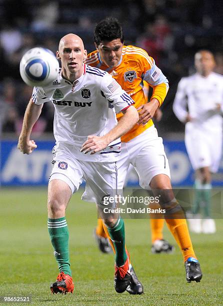 Tim Ward of the Chicago Fire and Luis Landin of the Houston Dynamo go for the loose ball in an MLS match on April 24, 2010 at Toyota Park in...