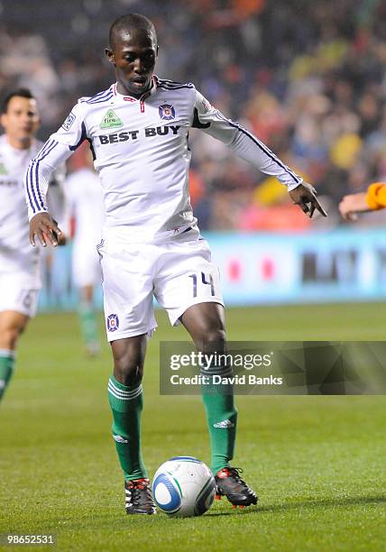 Patrick Nyarko of the Chicago Fire brings the ball forward against the Houston Dynamo in an MLS match on April 24, 2010 at Toyota Park in Brideview,...
