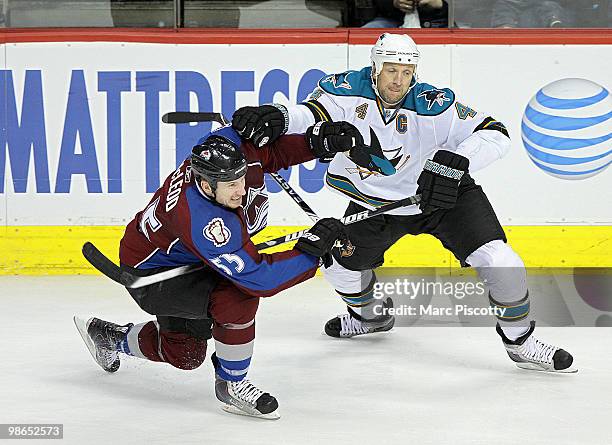 Cody McLeod of the Colorado Avalanche gets tangled up with Rob Blake of the San Jose Sharks in the second period of Game Six of the Western...