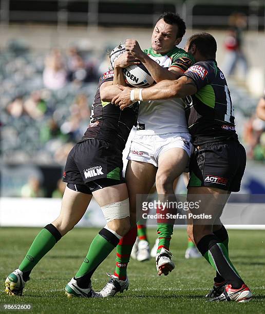 Garret Crossman of the Rabbitohs is tackled during the round seven NRL match between the Canberra Raiders and the South Sydney Rabbitohs at Canberra...
