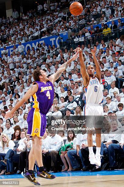 Eric Maynor of the Oklahoma City Thunder shoots a jump shot over Luke Walton of the Los Angeles Lakers in Game Four of the Western Conference...