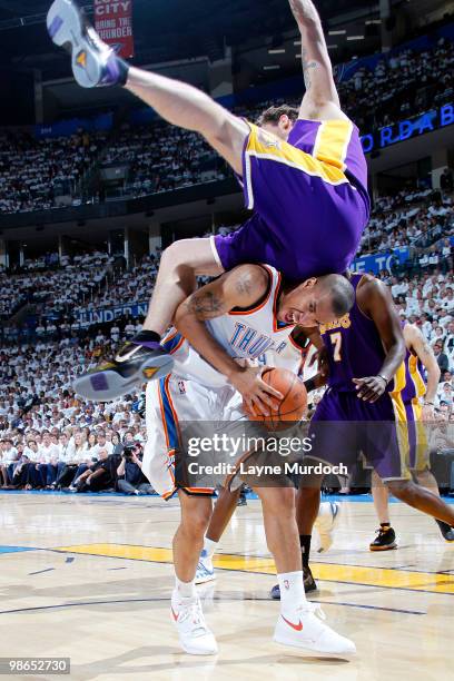 Luke Walton of the Los Angeles Lakers flips over Eric Maynor of the Oklahoma City Thunder in Game Four of the Western Conference Quarterfinals during...