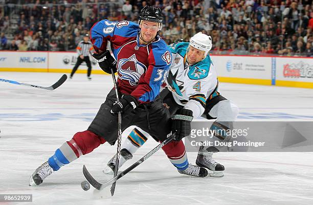 Galiardi of the Colorado Avalanche has a back handed shot rejected by the defense of Rob Blake of the San Jose Sharks in Game Six of the Western...