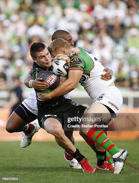 Josh Dugan of the Raiders is tackled during the round seven NRL match between the Canberra Raiders and the South Sydney Rabbitohs at Canberra Stadium...