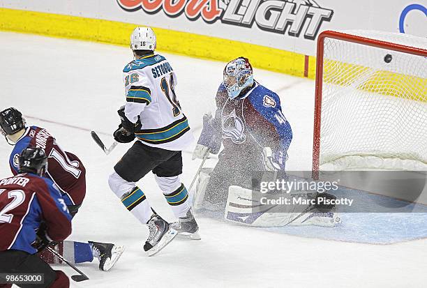 Goaltender Craig Anderson of the Colorado Avalanche lets the puck slip by for what would turn out to be the game winner as Devin Setoguchi#16 of the...