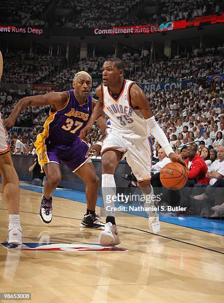 Kevin Durant of the Oklahoma City Thunder dribbles against Ron Artest of the Los Angeles Lakers in Game Four of the Western Conference Quarterfinals...