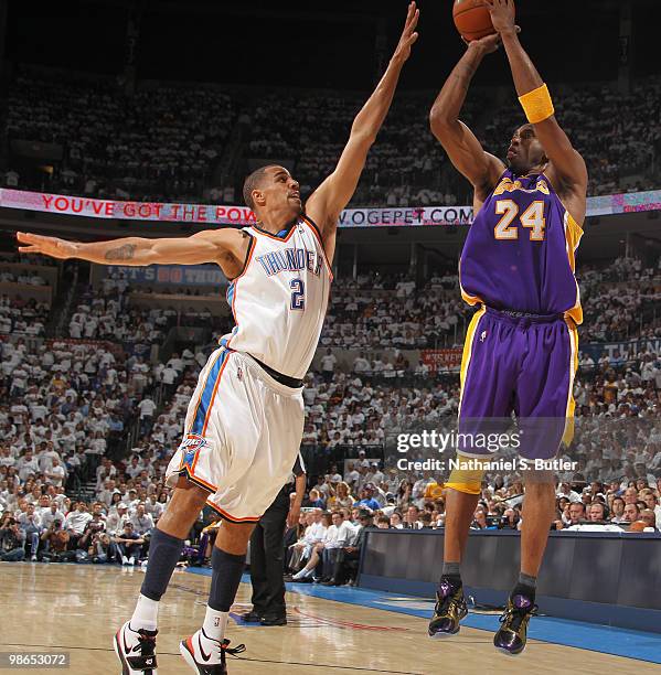 Kobe Bryant of the Los Angeles Lakers shoots against Thabo Sefolosha of the Oklahoma City Thunder in Game Four of the Western Conference...