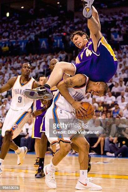 Luke Walton of the Los Angeles Lakers flips over Eric Maynor of the Oklahoma City Thunder during Game Four of the Western Conference Quarterfinals of...