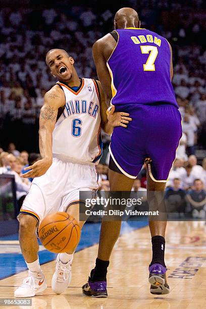Eric Maynor of the Oklahoma City Thunder is fouled against Lamar Odom of the Los Angeles Lakers during Game Four of the Western Conference...