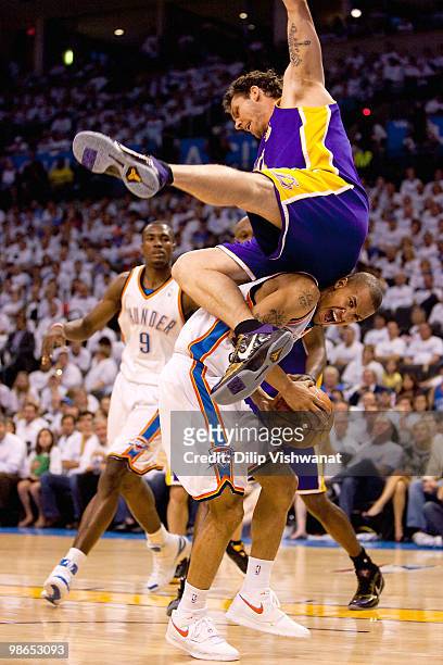 Luke Walton of the Los Angeles Lakers flips over Eric Maynor of the Oklahoma City Thunder during Game Four of the Western Conference Quarterfinals of...
