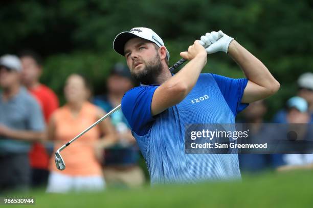 Marc Leishman of Australia hits off the ninth tee during the first round of the Quicken Loans National at TPC Potomac on June 28, 2018 in Potomac,...