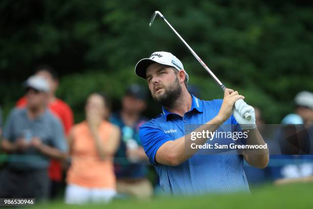 Marc Leishman of Australia hits off the ninth tee during the first round of the Quicken Loans National at TPC Potomac on June 28, 2018 in Potomac,...