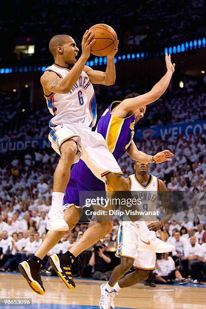 Eric Maynor of the Oklahoma City Thunder shoots the ball against Jordan Farmar of the Los Angeles Lakers during Game Four of the Western Conference...