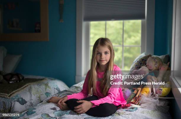 Rhys Cote poses for a portrait in her room at her home in Wells. Rhys has been modeling since she was a toddler and has acted in commercials. She was...