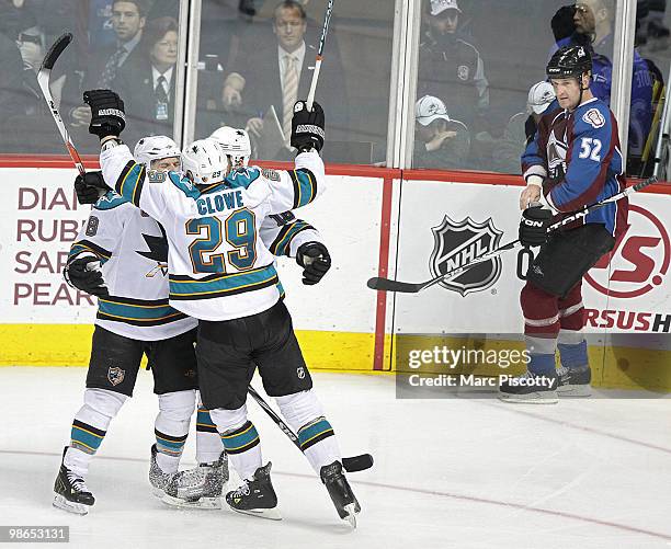 Joe Pavelski of the San Jose Sharks celebrates with teammates Devin Setoguchi and Ryane Clowe after Pavelski scored what would turn out to be the...