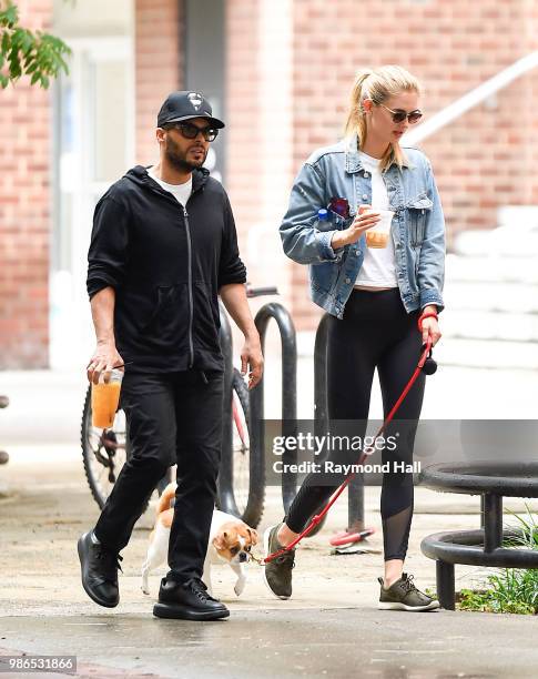 Richie Akiva And Megan Williams are seen walking in soho on June 28, 2018 in New York City.