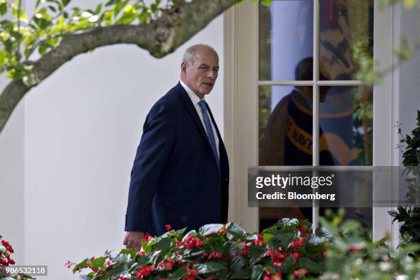 John Kelly, White House chief of staff, walks toward the Oval Office of the White House after arriving on Marine One in Washington, D.C., U.S., on...