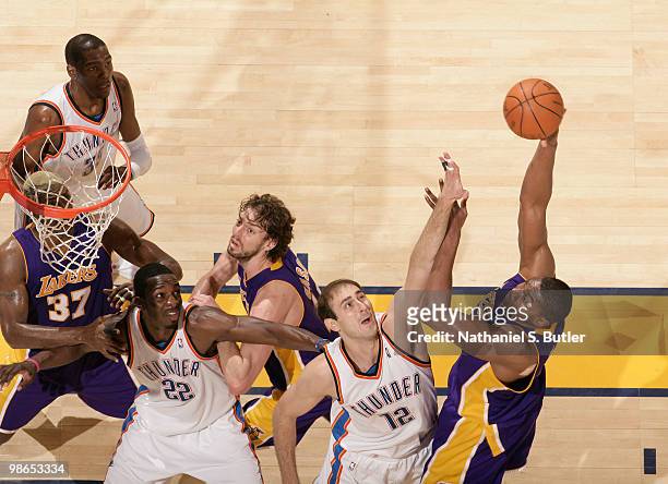 Andrew Bynum of the Los Angeles Lakers shoots against Nenad Krstic of the Oklahoma City Thunder as Pau Gasol, Jeff Green, Ron Artest and Kevin Durant...