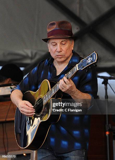 Paul Simon of Simon and Garfunkel performs at the 41st Annual New Orleans Jazz & Heritage Festival Presented by Shell Fair Grounds Race Course on...