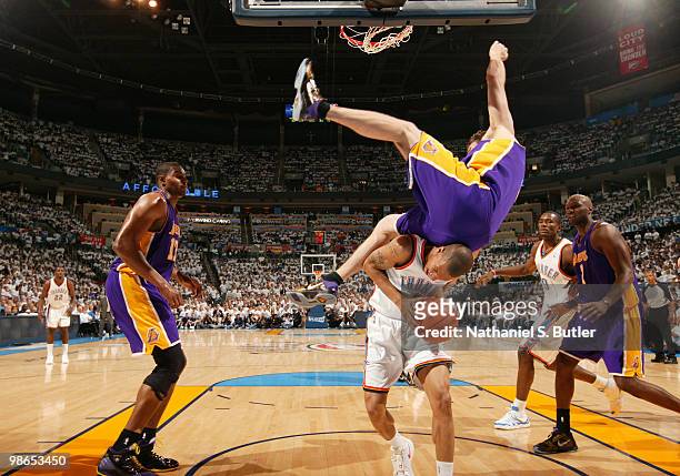 Luke Walton of the Los Angeles Lakers topples over Eric Maynor of the Oklahoma City Thunder in Game Four of the Western Conference Quarterfinals...
