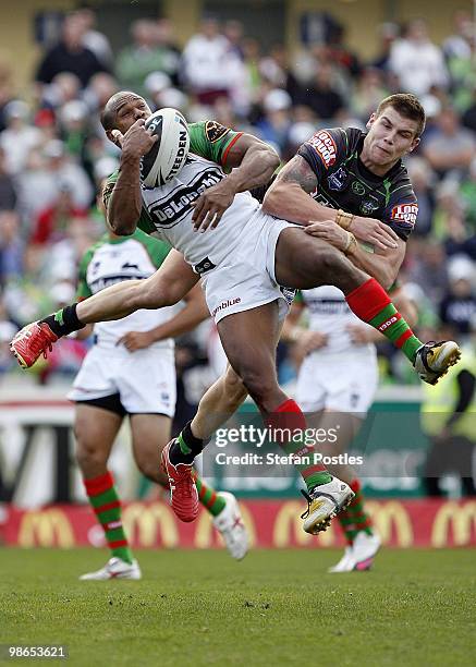 Josh Dugan of the Raiders and Rhys Wesser of the Rabbitohs challenge for a high ball during the round seven NRL match between the Canberra Raiders...