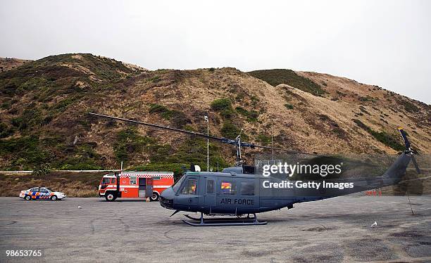 Royal New Zealand Air Force Iroquois helicopter leaves for Ohakea Air Base beneath the site of the accident of an Iroquois helicopter after it...