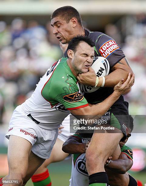 Tom Learoyd-Lahrs of the Raiders is tackled by Beau Champion of the Rabbitohs during the round seven NRL match between the Canberra Raiders and the...