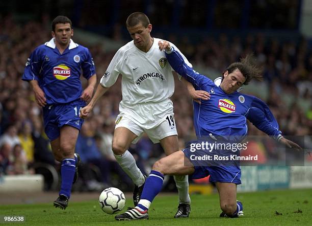 Eirik Bakke of Leeds is tackled by Matthew Jones of Leicester during the Leeds United v Leicester City FA Carling Premiership match at Elland Road,...